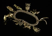 Lot 215 - A gold curb link charm bracelet