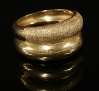 Lot 221 - An Egyptian two-row tapering domed band ring