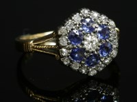 Lot 104 - A diamond and sapphire hexagonal cluster ring