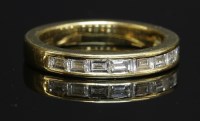 Lot 315 - An 18ct gold diamond half eternity ring
