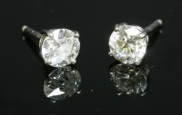 Lot 361 - A pair of 18ct white gold single stone diamond earrings