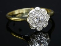 Lot 166 - An Edwardian diamond set daisy cluster ring