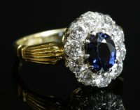 Lot 343 - An 18ct gold sapphire and diamond oval cluster ring