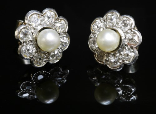 Lot 137 - A pair of cultured pearl and diamond daisy cluster earrings