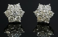 Lot 368 - A pair of white gold diamond cluster earrings