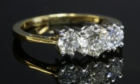 Lot 293 - A yellow and white gold three stone diamond ring