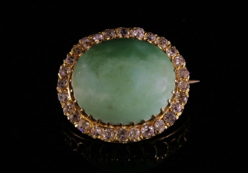Lot 73 - A Victorian turquoise and diamond oval cluster brooch