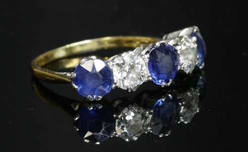 Lot 339 - A five stone graduated sapphire and diamond ring
