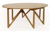 Lot 455 - A Danish oval teak drop-leaf dining table