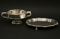 Lot 151 - A silver twin handled squat form bowl on pedestal base