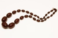 Lot 85 - A single row graduated cherry coloured olive shaped Bakelite bead necklace (with swirls)
60.24g
