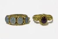Lot 25 - A 9ct gold four stone cabochon aquamarine ring