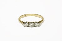 Lot 3 - A gold three stone diamond ring (marked indistinctly 18ct and plat)
2.12g
