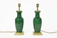Lot 382 - A pair of green crackle glaze lamps
