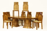 Lot 549 - An Art Deco style burr wood finish dining table