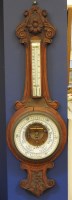 Lot 395 - An early 20th century oak cased aneroid barometer