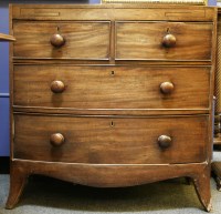 Lot 452 - An early 19th century mahogany bow front chest of drawers