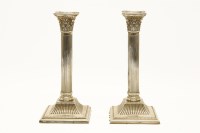Lot 184 - A pair of early 20th century silver candlesticks of Corinthian column form
