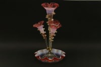 Lot 373 - A late 19th century cranberry vaseline glass epergne