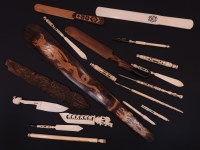 Lot 217 - A quantity of carved wooden bone and ivory paper knives and associated items