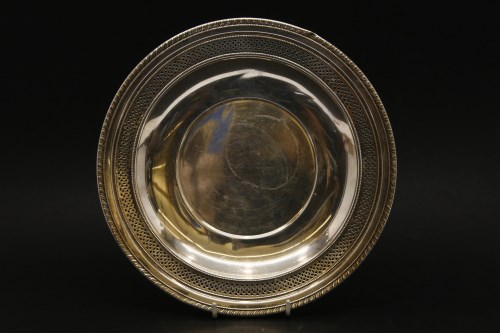 Lot 182 - A Cartier pierced silver plate of circular form
