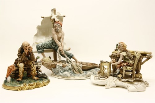 Lot 269 - A Capodimonte figure of a fisherman pulling his net