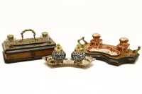 Lot 366 - An inkwell and stand with mahogany frame and cast iron motif