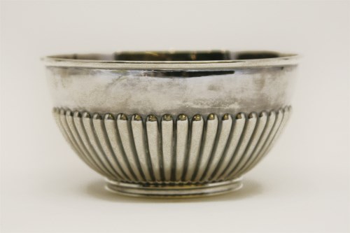 Lot 211 - An early 20th century silver bowl of half gadrooned form