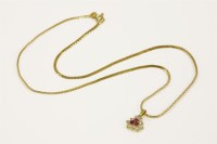 Lot 118 - A gold ruby and cubic zirconia pendant
