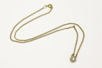 Lot 68 - A gold diamond horseshoe on a 9ct gold curb chain
3.33g