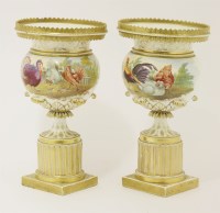 Lot 242 - A pair of porcelain urns