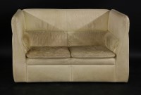 Lot 586 - A Danish cream leather settee