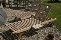 Lot 1018 - A pair of Barlow Tyrie teak plantation loungers