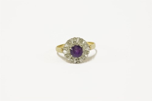 Lot 104 - An 18ct gold amethyst and diamond cluster ring