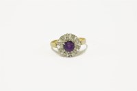 Lot 104 - An 18ct gold amethyst and diamond cluster ring