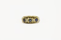 Lot 59 - An 18ct gold five stone sapphire and diamond boat shaped ring