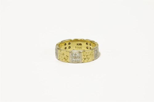 Lot 64 - An 18ct gold two colour gold wedding ring