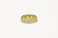 Lot 64 - An 18ct gold two colour gold wedding ring