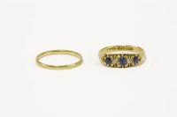 Lot 114 - An 18ct gold five stone sapphire and diamond boat shaped ring