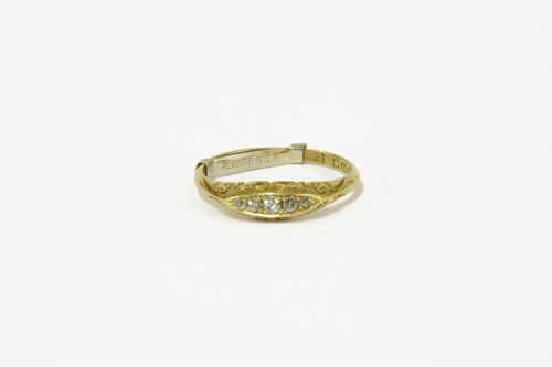 Lot 99 - An 18ct gold five stone diamond boat shaped ring