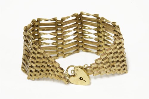 Lot 128 - A gold nine row gate link bracelet