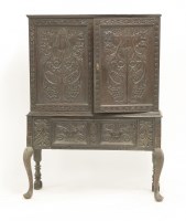 Lot 614 - A 19th century carved oak side cabinet