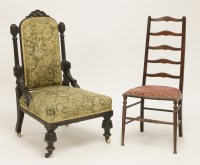 Lot 591 - A Victorian carved and ebonised oak salon chair