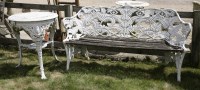 Lot 1036 - A cast aluminium bench with fern moulded back