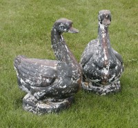 Lot 1041 - A pair of cast iron lawn ornaments in the form of geese