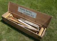 Lot 1045 - A croquet set in a pine box