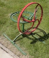 Lot 1047 - A green and red painted Pluviette lawn sprinkler.