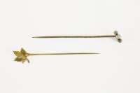Lot 6 - A gold three stone pearl and diamond stick pin in case