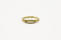Lot 95 - An 18ct gold five stone diamond boat shaped ring (one stone deficient)