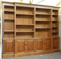 Lot 621 - A Victorian design walnut breakfront bookcase